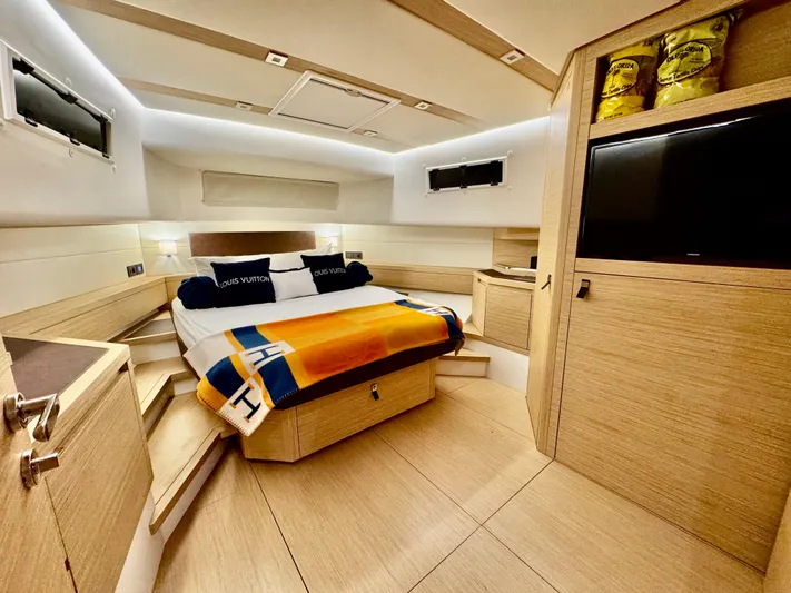 La Doña Yacht Photos Pics Luxurious cabin interior of 2023 Pardo Yachts 50, featuring modern design and cozy bedding.