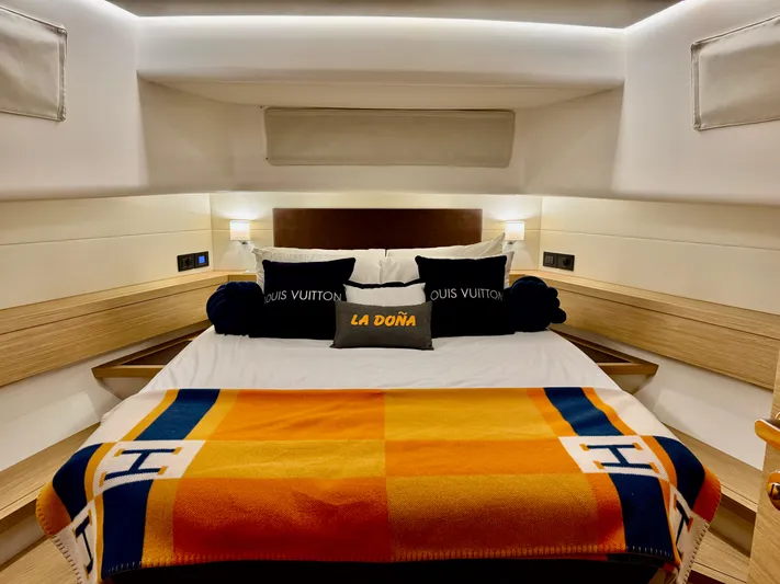La Doña Yacht Photos Pics Luxurious bedroom interior of 2023 Pardo Yachts 50 with designer bedding and elegant lighting.