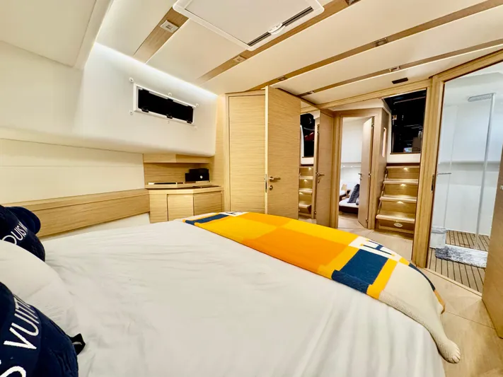 La Doña Yacht Photos Pics Luxurious cabin interior of 2023 Pardo Yachts 50, featuring modern design and cozy bedding.