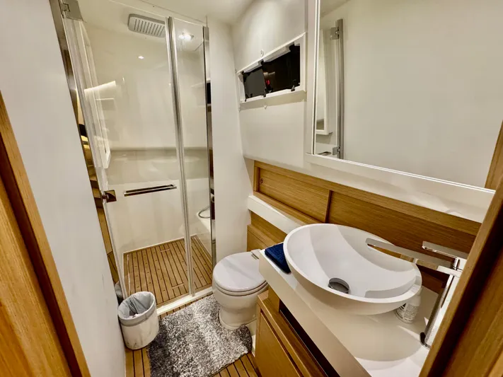 La Doña Yacht Photos Pics Modern bathroom in 2023 Pardo Yachts 50, featuring sleek design and wooden accents.