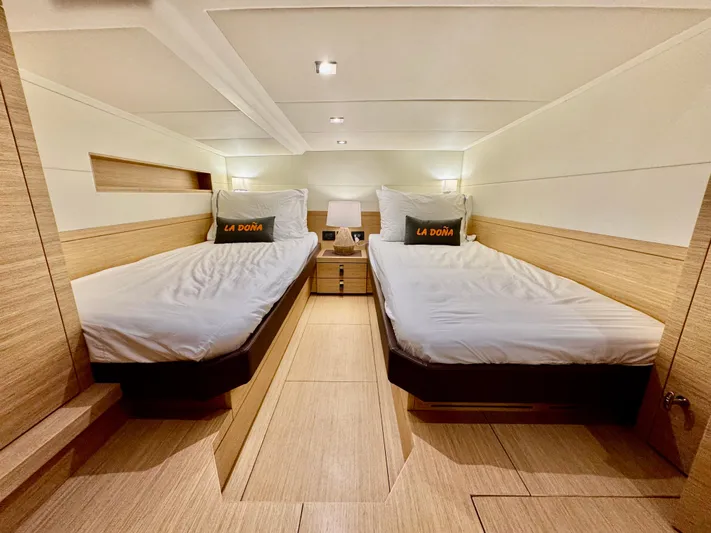 La Doña Yacht Photos Pics Luxurious cabin interior of 2023 Pardo Yachts 50 with twin beds and modern decor.