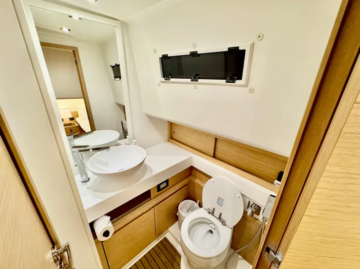 La Doña Yacht Photos Pics Modern bathroom in 2023 Pardo Yachts 50, featuring sleek design and wooden accents.