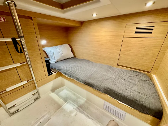 La Doña Yacht Photos Pics 2023 Pardo Yachts 50 cabin interior with single bed and modern wood finish.