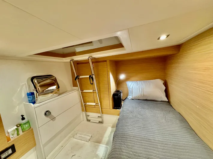 La Doña Yacht Photos Pics 2023 Pardo Yachts 50 cabin interior with single bed, ladder, and modern lighting.