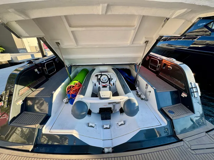 La Doña Yacht Photos Pics 2023 Pardo Yachts 50 with open storage compartment, showcasing interior equipment and accessories.