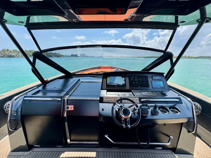 La Doña Yacht Photos Pics Cockpit view of 2023 Pardo Yachts 50, featuring modern controls and ocean backdrop.