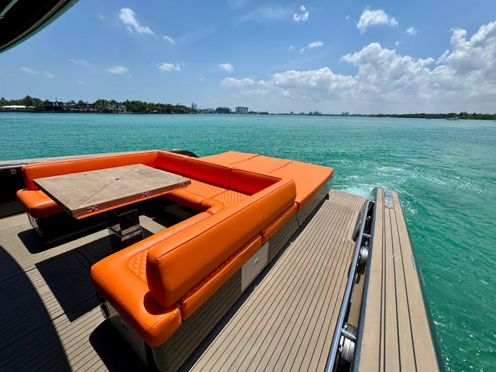 La Doña Yacht Photos Pics Luxury Pardo Yachts 50, 2023 model, with vibrant orange seating and scenic ocean view.