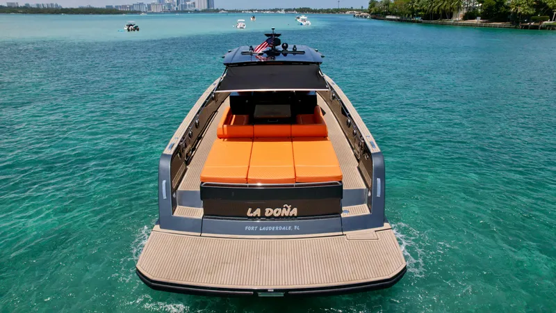 La Doña Yacht Photos Pics 2023 Pardo Yachts 50 on turquoise water, rear view with orange seating.