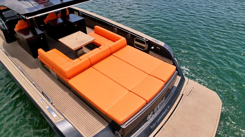 La Doña Yacht Photos Pics 2023 Pardo Yachts 50 with orange seating, spacious deck, and elegant design on the water.