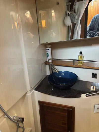  Yacht Photos Pics 2024 Ranger Tugs R31S bathroom with modern sink and mirror.