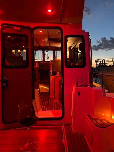  Yacht Photos Pics 2024 Ranger Tugs R31S boat interior with red lighting at sunset.