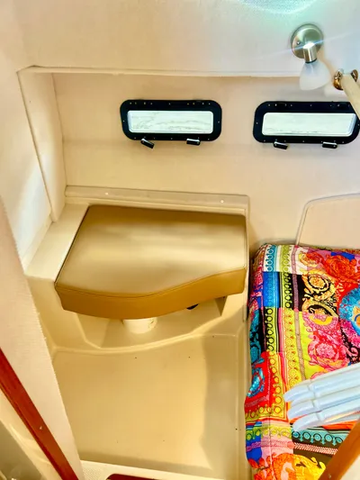  Yacht Photos Pics 2024 Ranger Tugs R31S interior with colorful bedding and dual windows.