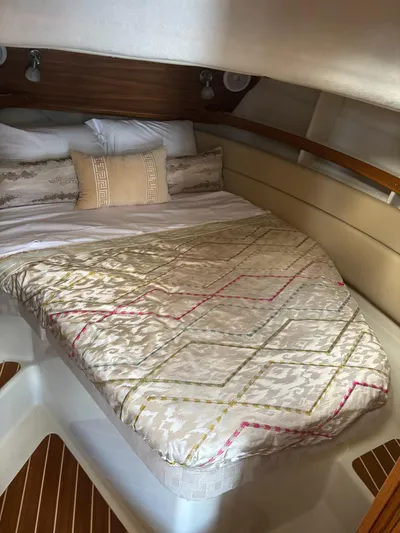  Yacht Photos Pics 2024 Ranger Tugs R31S cabin with cozy bed and elegant bedding.