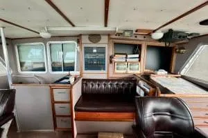 Western Shore Yacht Photos Pics 1989 Custom Expedition boat interior with navigation equipment and leather seating.