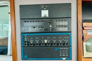 Western Shore Yacht Photos Pics 1989 Custom Expedition control panel with various switches and dials, mounted on a wall.