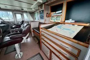 Western Shore Yacht Photos Pics 1989 Custom Expedition interior with navigation desk and leather seating.