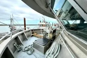 Western Shore Yacht Photos Pics 1989 Custom Expedition boat deck with ropes and equipment, docked at a marina.