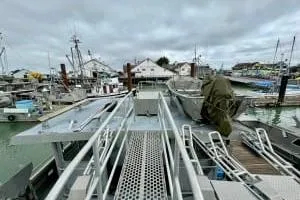 Western Shore Yacht Photos Pics 1989 Custom Expedition boat docked in a busy marina with overcast skies.