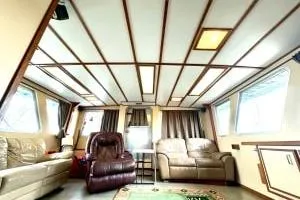 Western Shore Yacht Photos Pics Luxurious interior of a 1989 Custom Expedition boat with comfortable seating and large windows.
