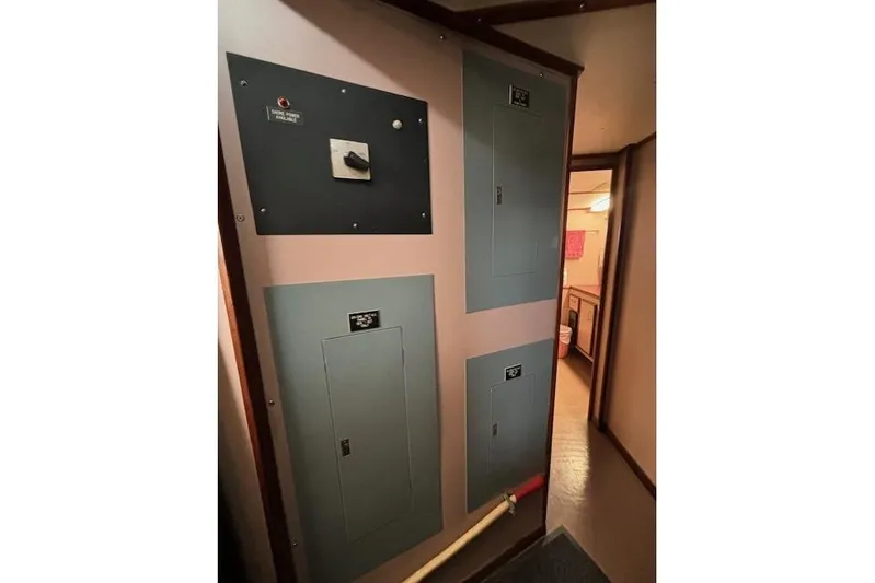 Western Shore Yacht Photos Pics Electrical panel inside a 1989 Custom Expedition vehicle, hallway view.