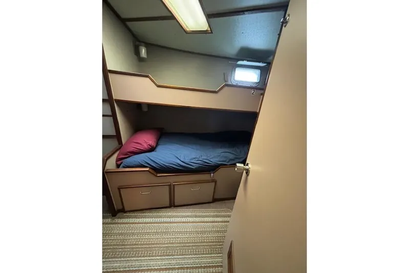 Western Shore Yacht Photos Pics Cozy cabin interior with bunk bed in 1989 Custom Expedition model.