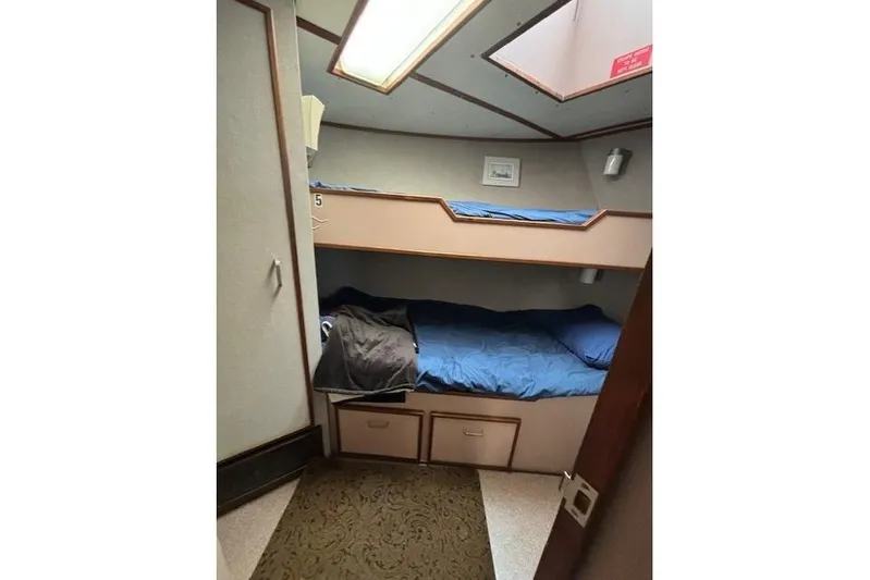 Western Shore Yacht Photos Pics Cozy 1989 Custom Expedition cabin with bunk beds and storage drawers.