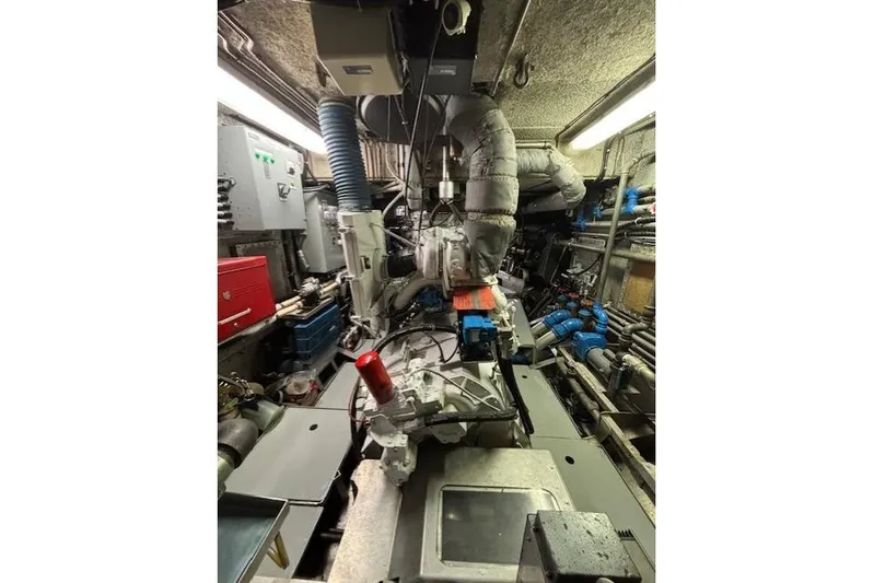 Western Shore Yacht Photos Pics Engine room of a 1989 Custom Expedition, featuring complex machinery and piping.