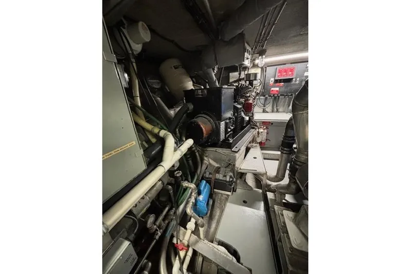Western Shore Yacht Photos Pics Engine room of a 1989 Custom Expedition, showcasing complex machinery and piping.