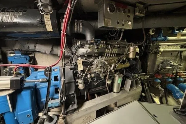 Western Shore Yacht Photos Pics Engine room of a 1989 Custom Expedition vehicle with complex machinery and wiring.