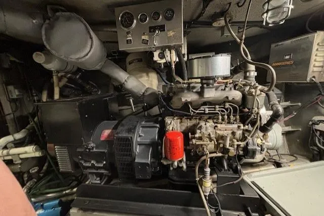 Western Shore Yacht Photos Pics Engine compartment of a 1989 Custom Expedition vehicle, showcasing mechanical components and wiring.