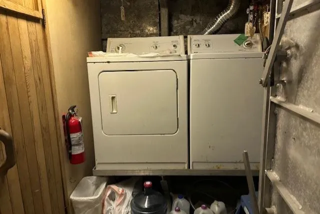 Western Shore Yacht Photos Pics Laundry room with washer, dryer, fire extinguisher, and storage containers.