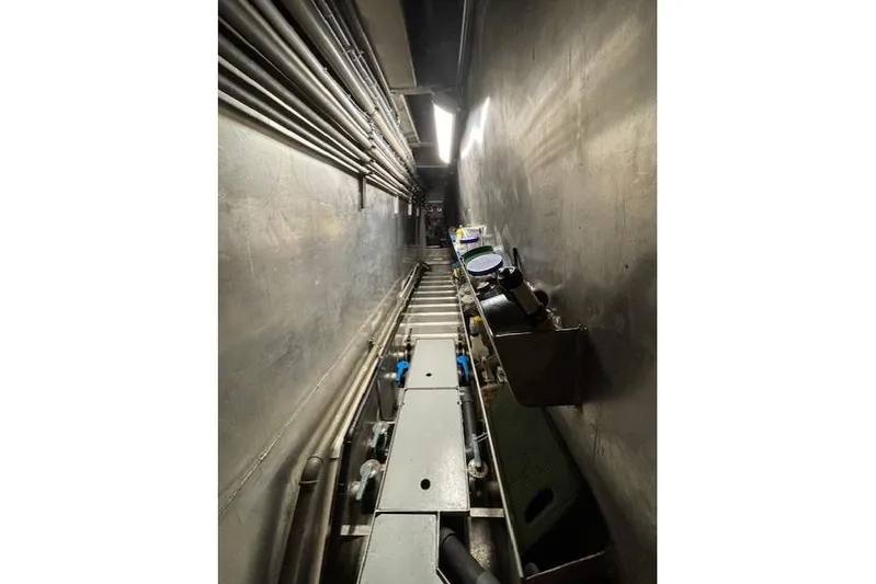 Western Shore Yacht Photos Pics Narrow industrial corridor with pipes and equipment, Custom Expedition 1989.