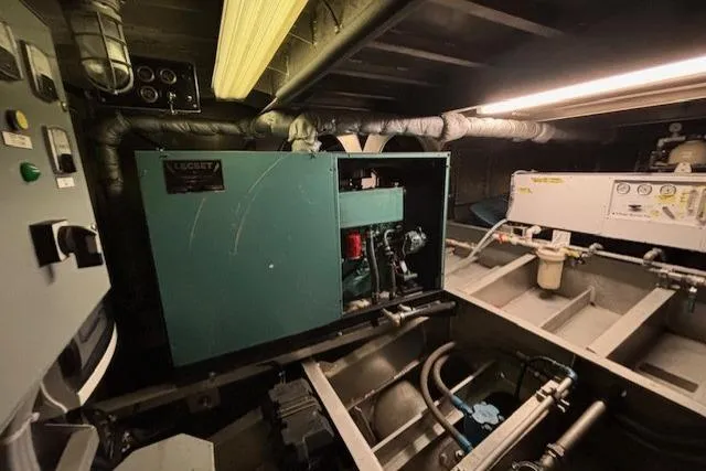 Western Shore Yacht Photos Pics Engine room of a 1989 Custom Expedition, featuring machinery and control panels.