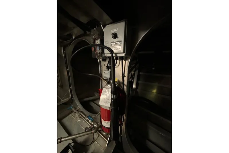 Western Shore Yacht Photos Pics Interior of a 1989 Custom Expedition vehicle with fire extinguisher and control panel.