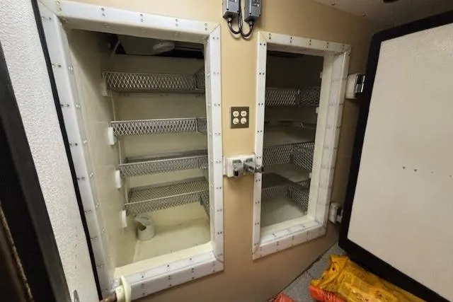 Western Shore Yacht Photos Pics Empty built-in storage shelves inside a 1989 Custom Expedition vehicle.