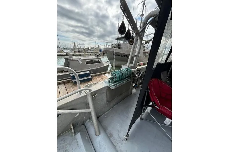 Western Shore Yacht Photos Pics 1989 Custom Expedition boat docked at marina, featuring deck equipment and mooring lines.