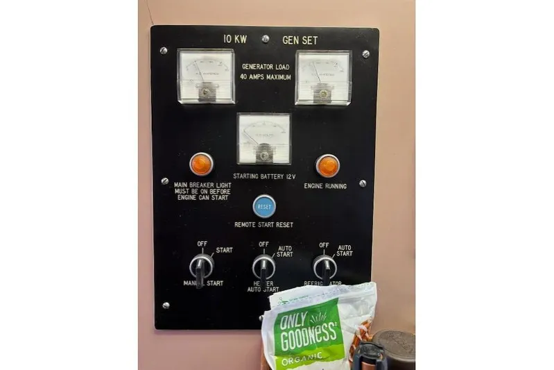 Western Shore Yacht Photos Pics Control panel of a 1989 Custom Expedition generator with meters and switches.