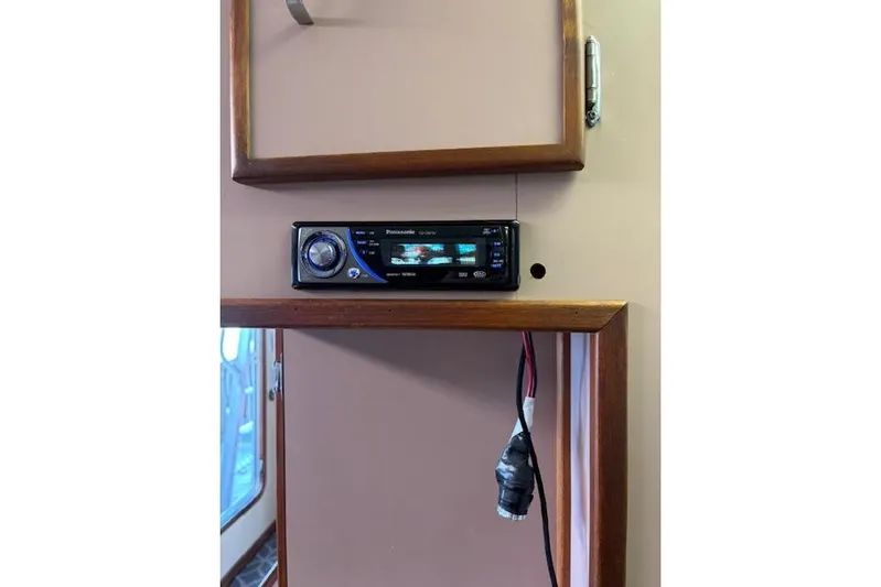 Western Shore Yacht Photos Pics 1989 Custom Expedition interior with Panasonic stereo system installed in wooden panel.