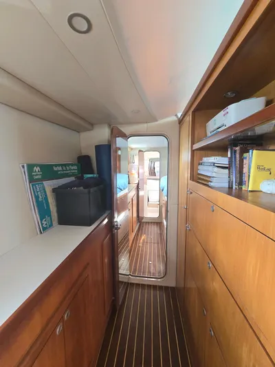Alacrity Yacht Photos Pics Interior of 2009 Fusion 40 yacht with wooden cabinetry and hallway view.