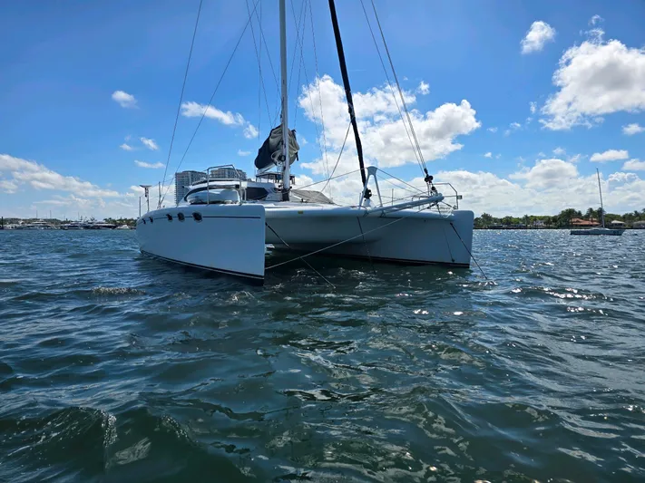 Alacrity Yacht Photos Pics 2009 Fusion 40 catamaran sailing on a sunny day with blue skies.