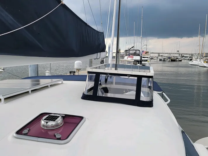 Alacrity Yacht Photos Pics 2009 Fusion 40 sailboat docked in marina, overcast sky.