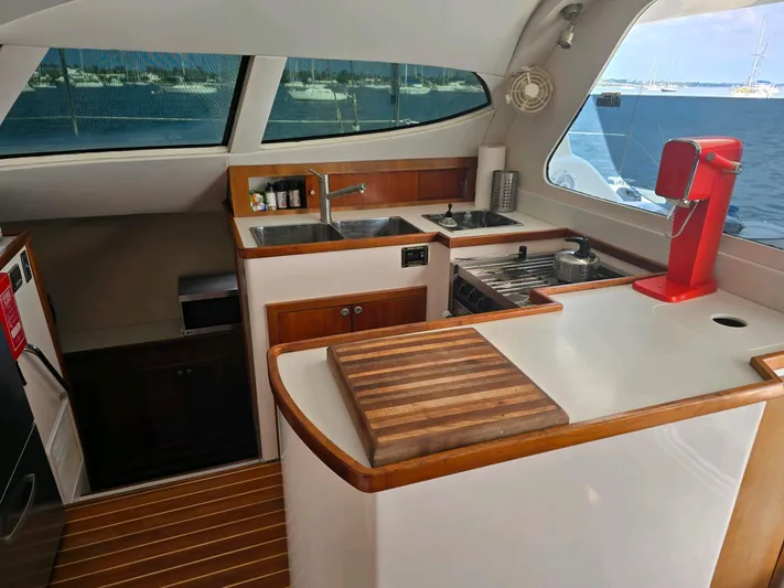 Alacrity Yacht Photos Pics 2009 Fusion 40 yacht kitchen with modern appliances and ocean view.