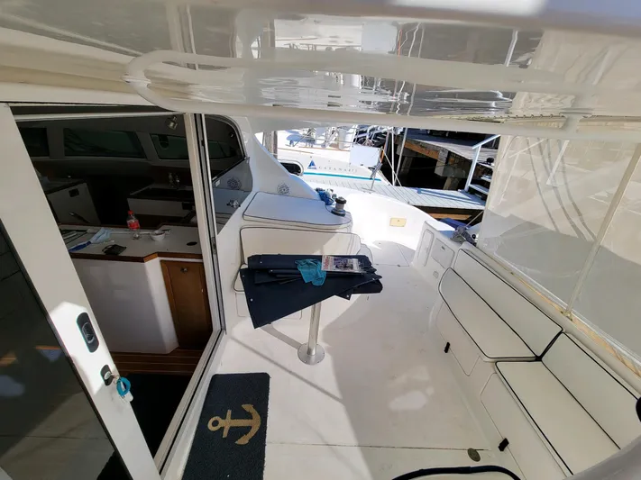 Alacrity Yacht Photos Pics Interior view of 2009 Fusion 40 yacht with seating and table.