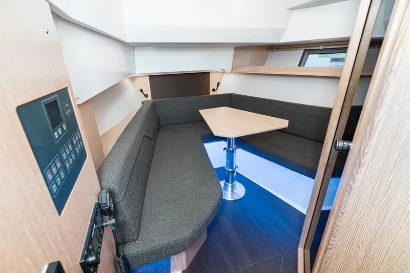 Yacht Photos Pics 2023 Bavaria Vida 33 interior with cozy seating and modern design.
