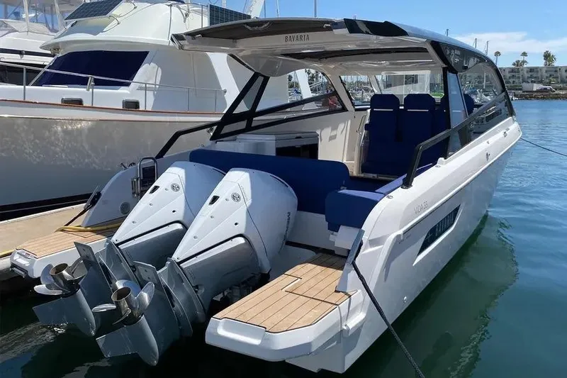  Yacht Photos Pics 2023 Bavaria Vida 33 motor yacht with dual engines docked in a marina.