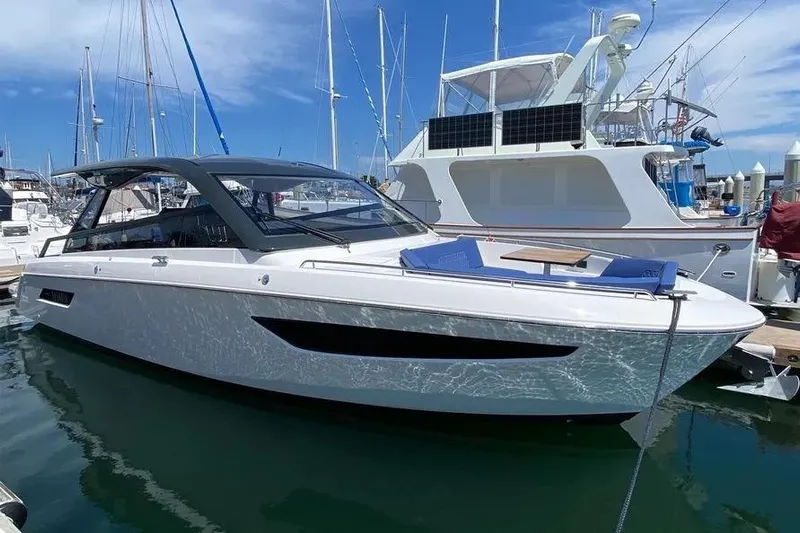  Yacht Photos Pics 2023 Bavaria Vida 33 yacht docked at marina under clear blue sky.