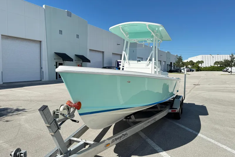  Yacht Photos Pics 2024 Albury Brothers 23 Forward Seating boat on trailer, parked outside industrial building.