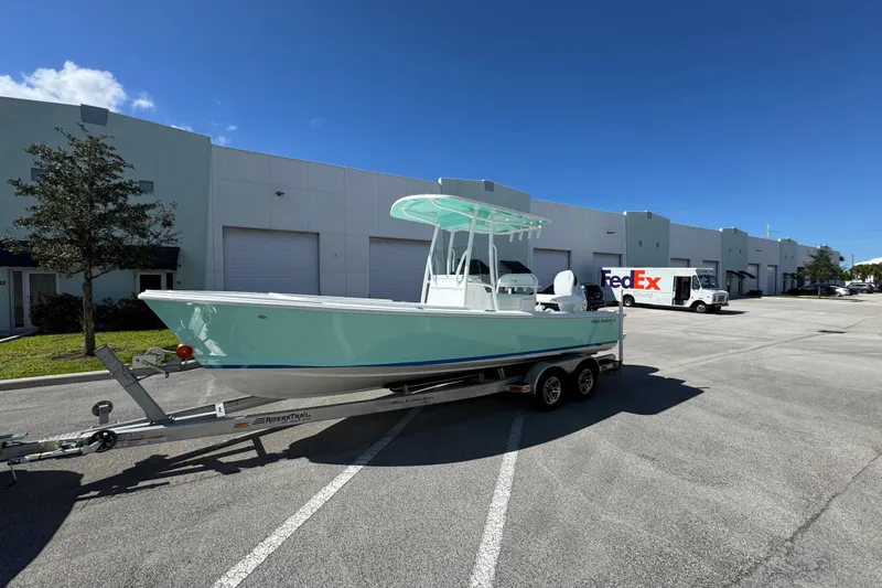  Yacht Photos Pics 2024 Albury Brothers 23 Forward Seating boat on trailer in parking lot.