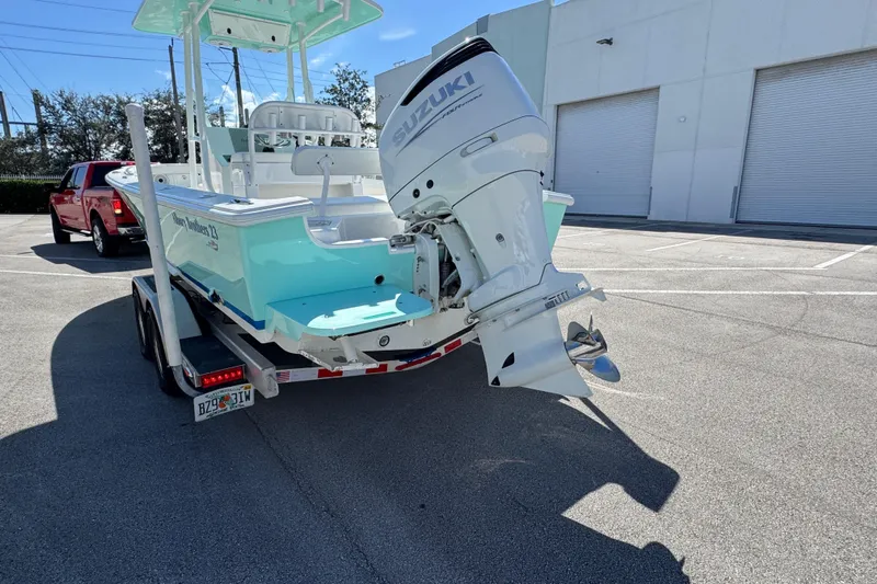  Yacht Photos Pics 2024 Albury Brothers 23 Forward Seating boat on trailer, featuring Suzuki outboard motor.