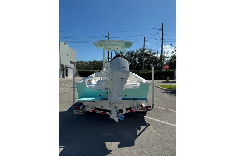  Yacht Photos Pics 2024 Albury Brothers 23 Forward Seating boat on trailer, rear view in parking lot.